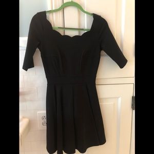 Black dress with scallop neckline